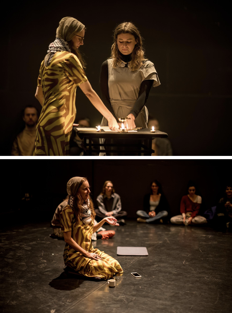 Two performers lighting candles during the Agency of Amber performance.